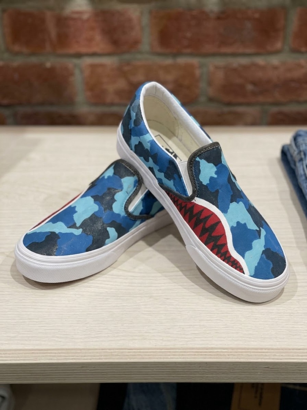 Vans Kids Blue Camo Slip-On Sneakers with Red Shark-Tooth Accent